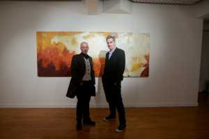 Mike Finn, right, playwright to Pigtown, with John Collins at Collins' of oils inspired by the play. At Bourn Vincent Gallery in UL Photo: Gareth Williams/ Press 22