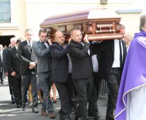 26/8/2015. Hundreds of people gather at Our Lady Queen of Peace Church, Janesboro, Limerick for the funeral of Jason Corbett who was killed in North Carolina earlier this month as the coffin the coffing bearing his remains is carried from the church. Photograph Liam Burke/Press 22Ê