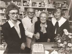 Pat Hogan and his wife Peg with their daughters Elenora and Marie (left) celebrating the pharmacy’s 50th anniversary in 1990.