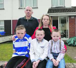 Damian Sheehan and his partner Alison Coffey with three of their six children Ronan, Dhannon and Morgan outside their Shannon Banks home. 