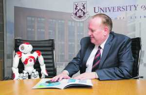 Professor Mike Hinchey with his robot assistant.