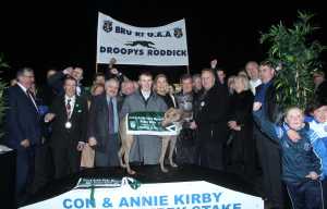 Noreen and JP Mc Manus presents the trophy to John Proctor whose dog Droopys Roddick won the Con And Annie Kirby Puppy Stakes at Limerick Greyhound Stadium also in picture Dean Coileman Handler. Picture Michael Cowhey.