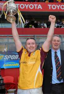2 January 2011; Bruff captain Cathal O'Reagan, in the company of Denis Kelliher, Munster Rugby Vice President, lifts the cup after victory over Garryowen. Munster Senior Cup Final, Garryowen v Bruff, Thomond Park, Limerick. Picture credit: Diarmuid Greene / SPORTSFILE