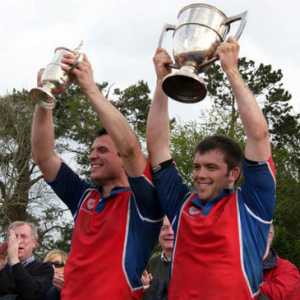 Anthony Hartigan and Cathal O'Neill hold the Junior and Transfield cups aloft in 2009