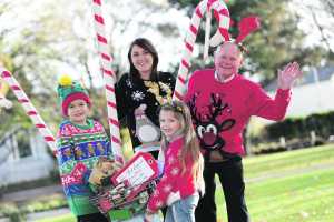Lughán Ó Riagáin (8), Iseult Ward (CEO and co-founder of FoodCloud), Ellamay Melia (6) and Joe Smith (Lions Club Coordinator) help launch the annual Christmas Food Appeal at Tesco.