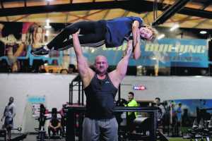 Pa O'Dwyer current holder of Ireland's strongest man lifting Niamh Kennedy from 'The Body Building', Raheen Business Park, Limerick. 