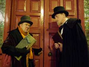 Brian McNamara as Scrooge with John Finn as Charles Dickens in this colourful choral drama
