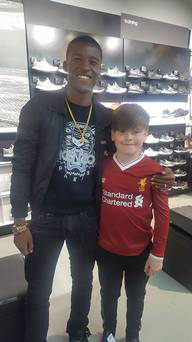 Georgino Wijnaldum with Paddy Mackessy in the Liverpool sports shop.