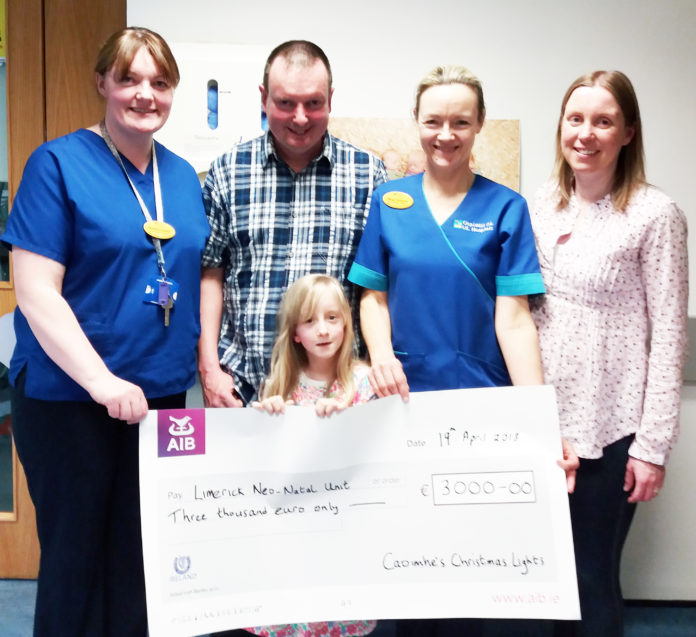 Caoimhe Lynch with her parents Kevin and Lorraine presenting the progeeds of th Christman lights fundraiser to clinical midwife managers Margo Dunworth and Deirdre O'Connell university hospital limerick maternity