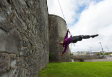Kate Lawrence of Vertical Dance performing on the side of Limericks King Johns Castle. Photo: Oisin McHugh True Media