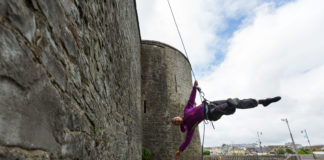 Kate Lawrence of Vertical Dance performing on the side of Limericks King Johns Castle. Photo: Oisin McHugh True Media