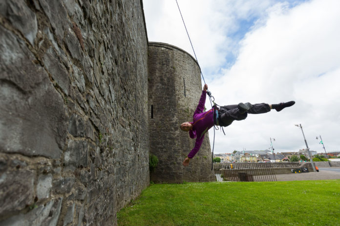 Kate Lawrence of Vertical Dance performing on the side of Limericks King Johns Castle. Photo: Oisin McHugh True Media