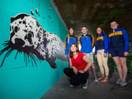 Pictured at the unveiling of the Mural were, Mary Conroy, Artist with St. Michaels Rowing Club volunteers who helped with the project, were, Cara MacMahon, Jack McKeown, Asia O'Brien and Ciara Marron. Picture: Alan Place