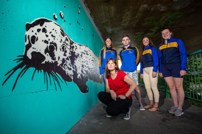 Pictured at the unveiling of the Mural were, Mary Conroy, Artist with St. Michaels Rowing Club volunteers who helped with the project, were, Cara MacMahon, Jack McKeown, Asia O'Brien and Ciara Marron. Picture: Alan Place