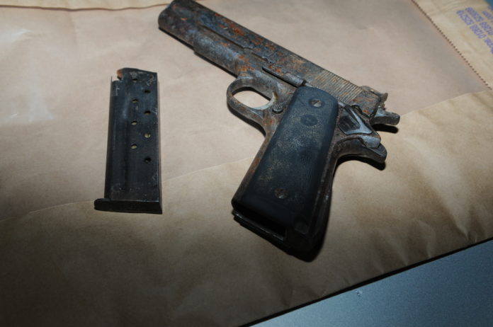 The two men were arrested as they tried to escape gardai with a loaded handgun
