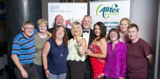 Members of the Thomas Street shop team; Front, left to right John Bromwell, Mary Iqbal, Antoinette Carroll, Patricia Moore, Sonia O’Neill, Shop Manager, Noreen Murphy, Anne Marie Glynn and Conrad Ryan. Behind them are Declan Byrne, SVP Retail Regional Manager, Mid-West (left) and Dermot McGilloway, SVP National Retail Development Manager.