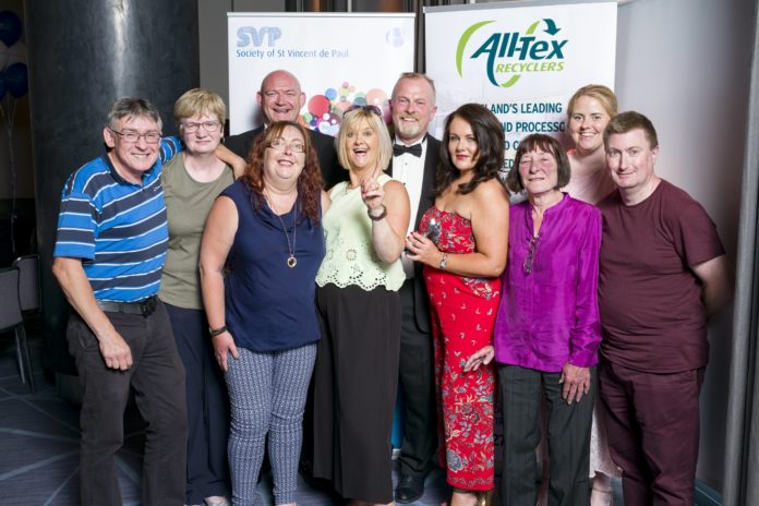 Members of the Thomas Street shop team; Front, left to right John Bromwell, Mary Iqbal, Antoinette Carroll, Patricia Moore, Sonia O’Neill, Shop Manager, Noreen Murphy, Anne Marie Glynn and Conrad Ryan. Behind them are Declan Byrne, SVP Retail Regional Manager, Mid-West (left) and Dermot McGilloway, SVP National Retail Development Manager.