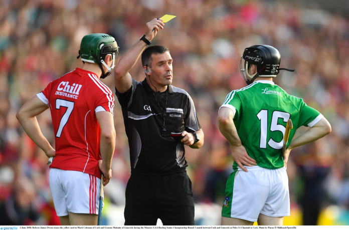 Cork v Limerick - Munster GAA Hurling Senior Championship Round 3 2 June 2018; Referee James Owens issues the yellow card to Mark Coleman of Cork and Graeme Mulcahy of Limerick during the Munster GAA Hurling Senior Championship Round 3 match between Cork and Limerick at Páirc Uí Chaoimh in Cork. Photo by Piaras Ó Mídheach/Sportsfile