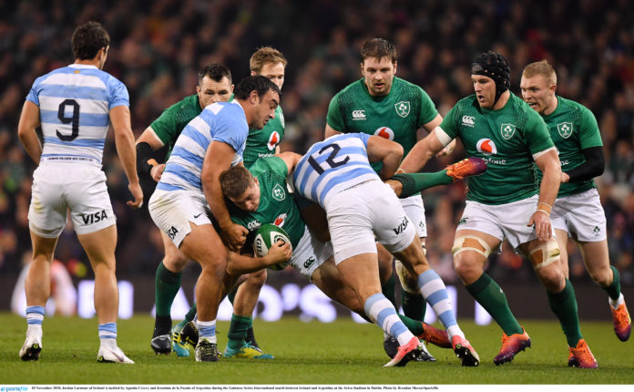Jordan Larmour of Ireland is tackled by Agustin Creevy and Jeronimo de la Fuente of Argentina during the Guinness Series International match between Ireland and Argentina at the Aviva Stadium in Dublin. Photo by Brendan Moran/Sportsfile