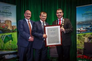 Dr Pat Daly, deputy chief executive Limerick City and County Council congratulates John Loftus, with Mayor James Collins