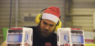 A member of the Sisk carpentry unit putting the finishing touches to toy trucks before dispatch to the Children's Ark at University Hospital Limerick.