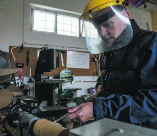 A member of the Shannon Men's Shed working on some wood turning. pic: Cian Reinhardt