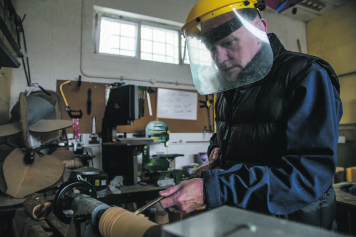 A member of the Shannon Men's Shed working on some wood turning. pic: Cian Reinhardt