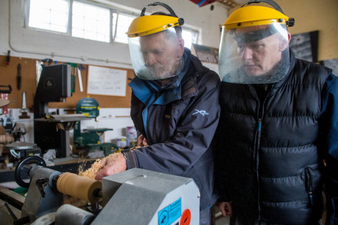 Men's Shed members working on some wood turning. pic: Cian Reinhardt