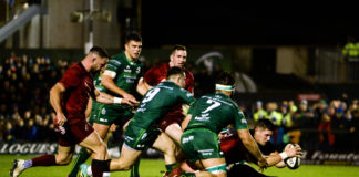 Dan Goggin of Munster scores his side's second try despite the efforts of Tom Daly of Connacht during the Guinness PRO14 Round 13 match between Connacht and Munster at the Sportsground in Galway. Photo by Diarmuid Greene/Sportsfile