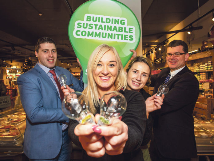 Celebrating their success in the Better Energy Communities Scheme were Gerard Walsh, Aoife Shiel, Hope Feehan and Jim Garvey at Garvey's Supervalu, Grove Island, Corbally. Photo: Alan Place