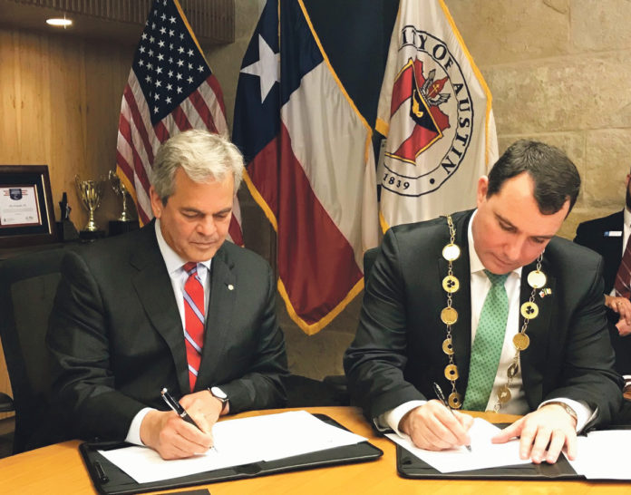 Austin Mayor Steve Adler signing the Memorandum of Understanding with Limerick Mayor James Collins.