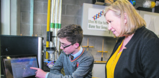 Niall Meade displays his 'Tag Buddy' app to teacher Diane Condon at Ardscoil Rís. Photo: Cian Reinhardt