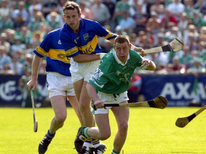 Brian O'Meara of Tipp and Ciaran Carey of Limerick Mandatory Credit©INPHO/Lorraine O'Sullivan