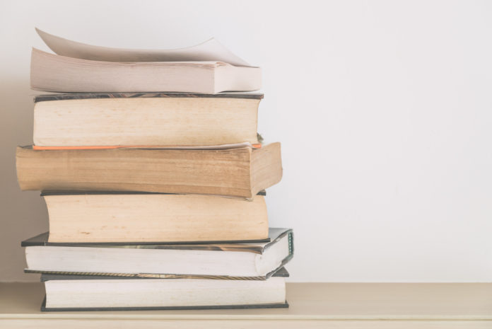 Book and eyeglasses with copy space - soft vintage filter