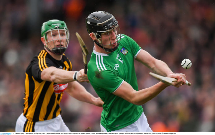 Conor Boylan of Limerick scores a point as Paul Murphy of Kilkenny closes in during the Allianz Hurling League Division 1A Round 3 match between Kilkenny and Limerick at Nowlan Park in Kilkenny. Photo by Piaras Ó Mídheach/Sportsfile