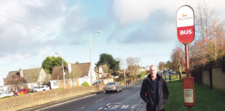 Local election candidate Francis Brosnahan at the bus stop on Fr Russell Road.