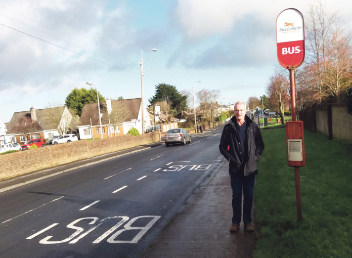 Local election candidate Francis Brosnahan at the bus stop on Fr Russell Road.