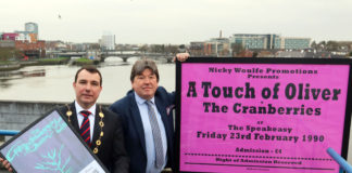 Mayor James Collins and Nicky Woulfe with two of the Cranberries posters. Photo: Brendan Gleeson