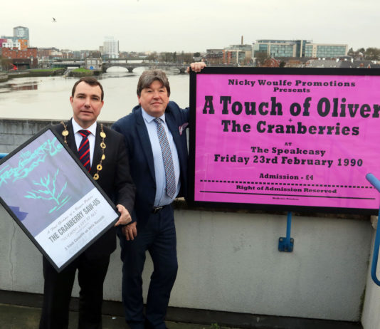 Mayor James Collins and Nicky Woulfe with two of the Cranberries posters. Photo: Brendan Gleeson