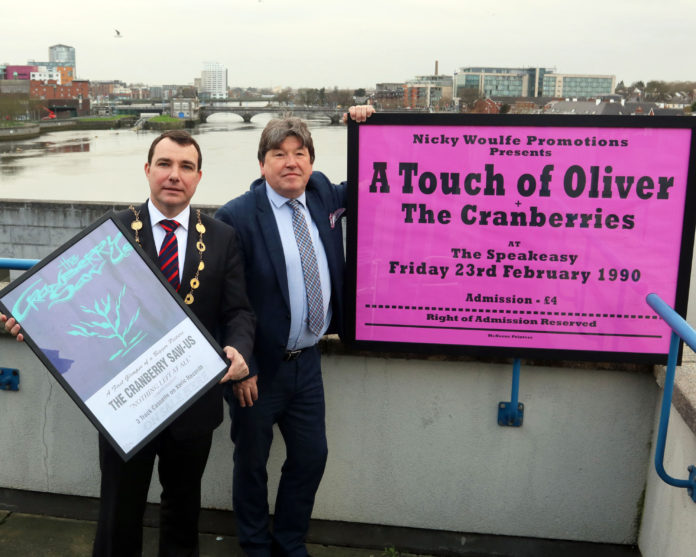 Mayor James Collins and Nicky Woulfe with two of the Cranberries posters. Photo: Brendan Gleeson