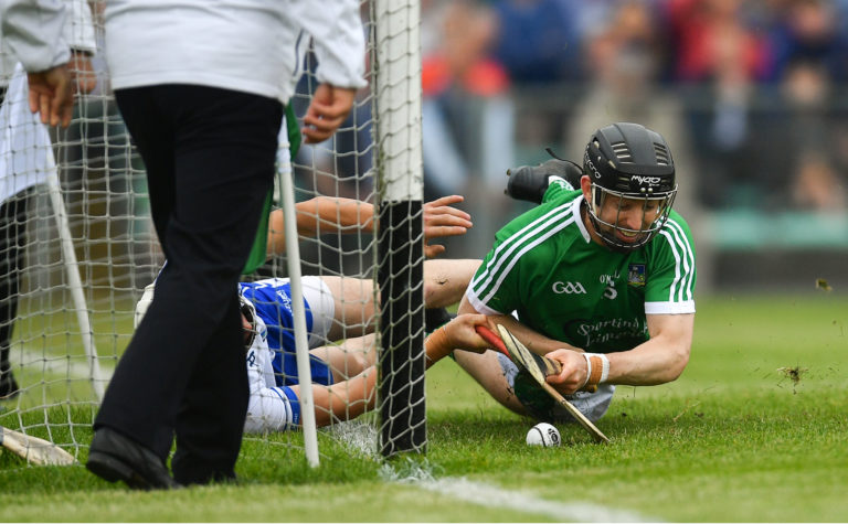 Graeme Mulcahy of Limerick shoots to score his side's second goal of the game despite the attention of Conor Gleeson of Waterford during the Munster GAA Hurling Senior Championship Round 4 match between Limerick and Waterford at the Gaelic Grounds in Limerick. Photo by Ramsey Cardy/Sportsfile