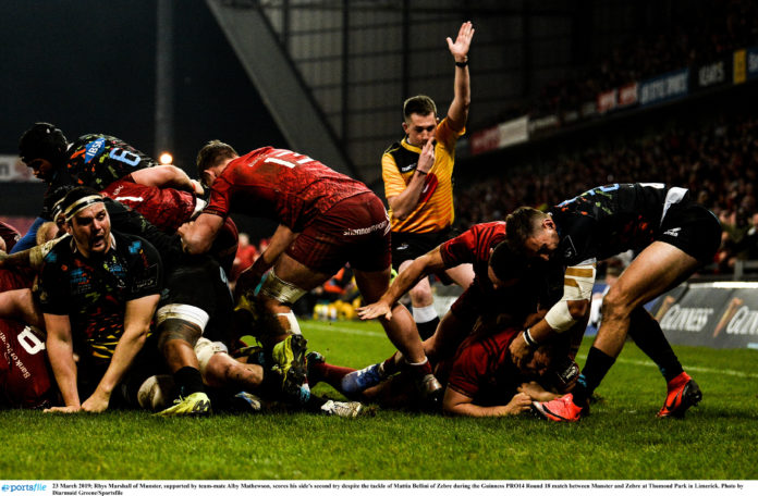 Rhys Marshall of Munster, supported by team-mate Alby Mathewson, scores his side's second try despite the tackle of Mattia Bellini of Zebre during the Guinness PRO14 Round 18 match between Munster and Zebre at Thomond Park in Limerick. Photo by Diarmuid Greene/Sportsfile