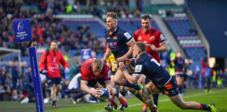 Keith Earls of Munster goes over to score his and his side's second try despite the tackle from Darcy Graham of Edinburgh during the Heineken Champions Cup Quarter-Final match between Edinburgh and Munster at BT Murrayfield Stadium in Edinburgh, Scotland. Photo by Brendan Moran/Sportsfile