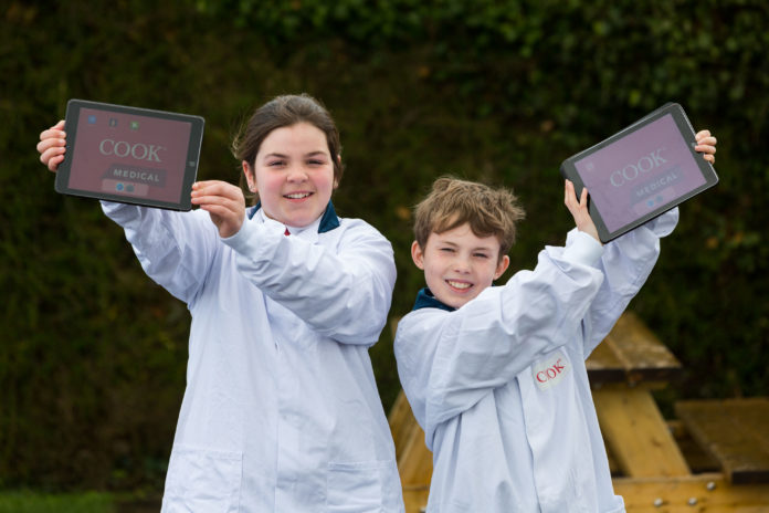 Cook Medical Monaleen NS 0002 To mark Engineers Week 2019, Patrick Denning, an engineer from global medtech company Cook Medical, visited Monaleen NS to educate local students on MedTech engineering by using Augmented Reality technology. Pictured at Monaleen National School is 5th class pupils Claire and Robert. Photo: Oisin McHugh True Media