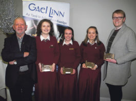 Pictured are the victorious Laurel Hill Secondary School senior debating team, (centre, l-r ) Karin Ní Mhásúin, Rachel Ní Mhuirí and Aisling Ní Dhomhnaill, who took the senior title at the Regional Final of the Gael Linn competition, Comórtas an Phiarsaigh 2019, along with Gael Linn representative, Gerry Motherway ( left ) and teacher James Kelly ( right )
