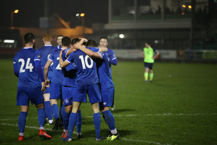 Conor Ellis celebrates with teammates after scoring Limerick's second goal of the game. Photo: Cian Reinhardt