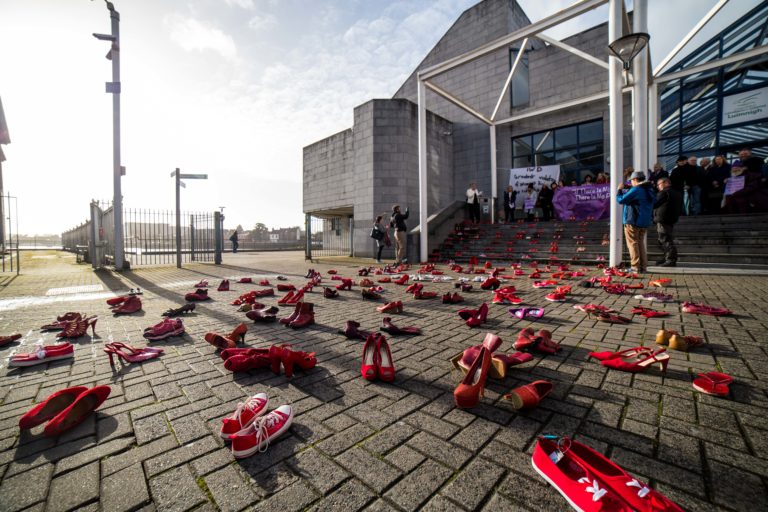 Red shoe demonstration on International Women’s Day highlights gender-based violence