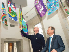 Paul O'Connell and JP McManus looking over some of the entries at the 'Design a TLC Bottle' prizegiving in the Hunt Museum Photo: Diarmuid Greene