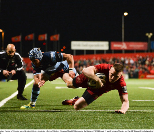 Andrew Conway of Munster scores his side's fifth try despite the efforts of Matthew Morgan of Cardiff Blues during the Guinness PRO14 Round 19 match between Munster and Cardiff Blues at Irish Independent Park in Cork. Photo by Diarmuid Greene/Sportsfile