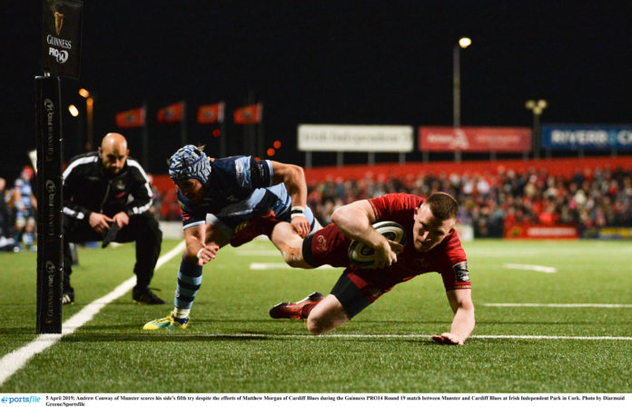 Andrew Conway of Munster scores his side's fifth try despite the efforts of Matthew Morgan of Cardiff Blues during the Guinness PRO14 Round 19 match between Munster and Cardiff Blues at Irish Independent Park in Cork. Photo by Diarmuid Greene/Sportsfile